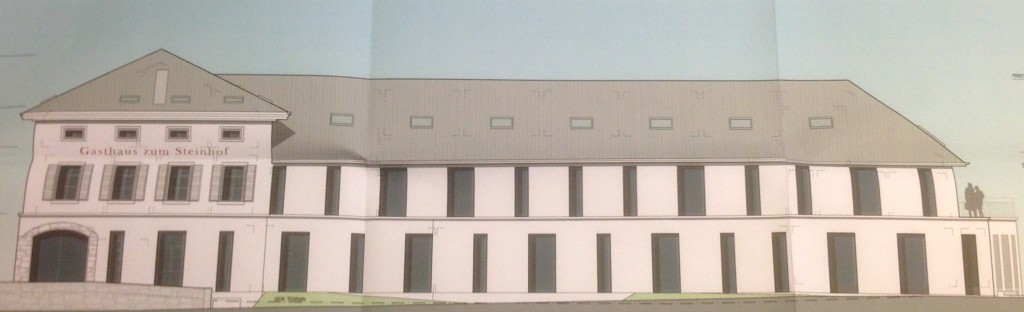 Der Kopfbau (links) mit dem langen Ersatzbau, von Norden (Parkplatz) aus gesehen.